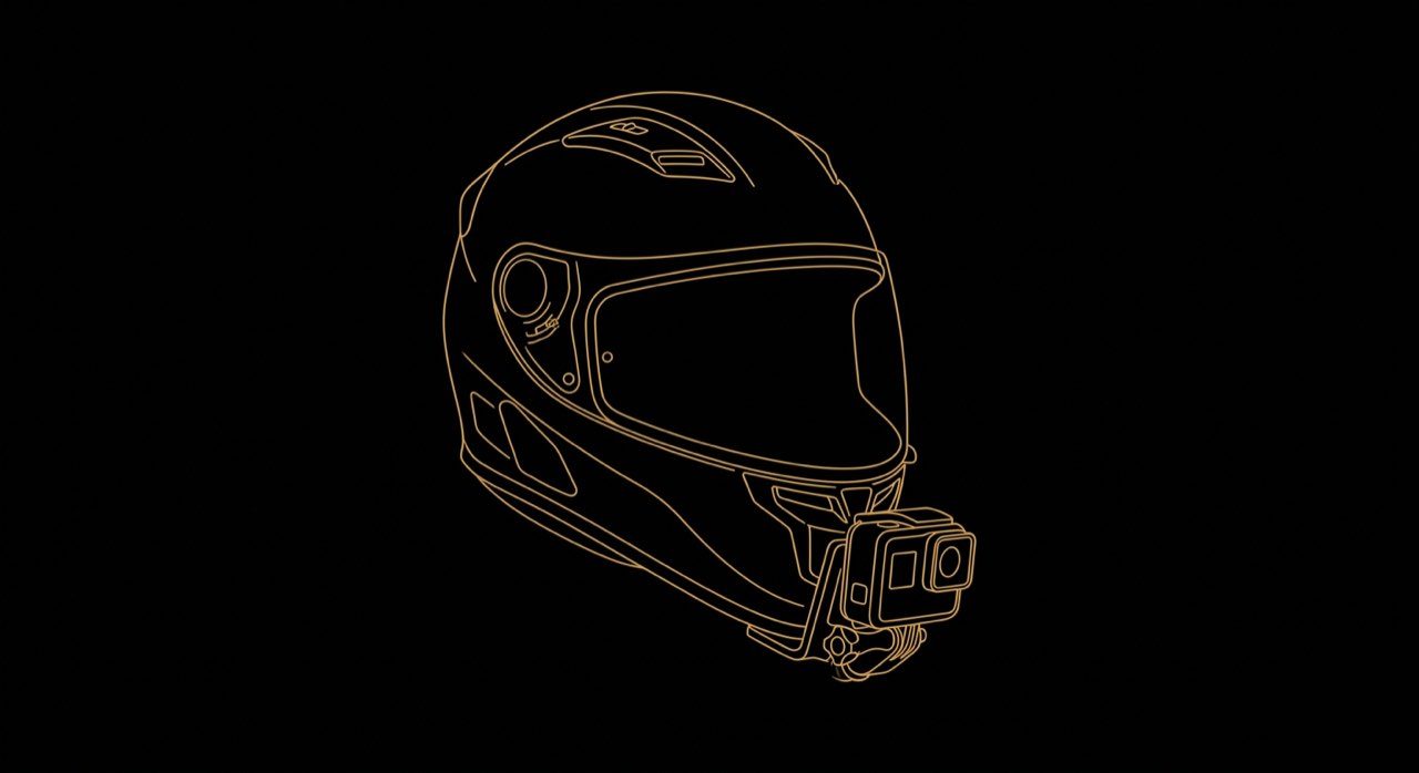 Adhesive chin mount base on a motorcycle helmet with an action camera pointing forward